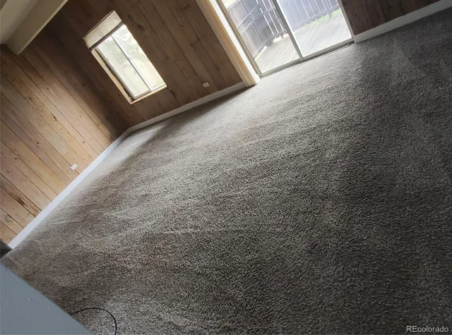 a view of an empty room and window