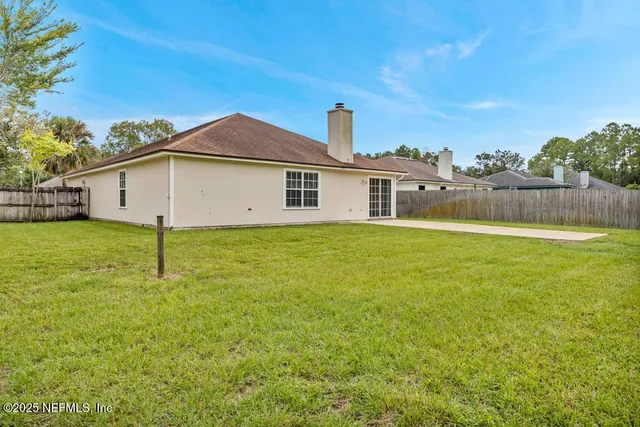 a view of a lake with houses in the background
