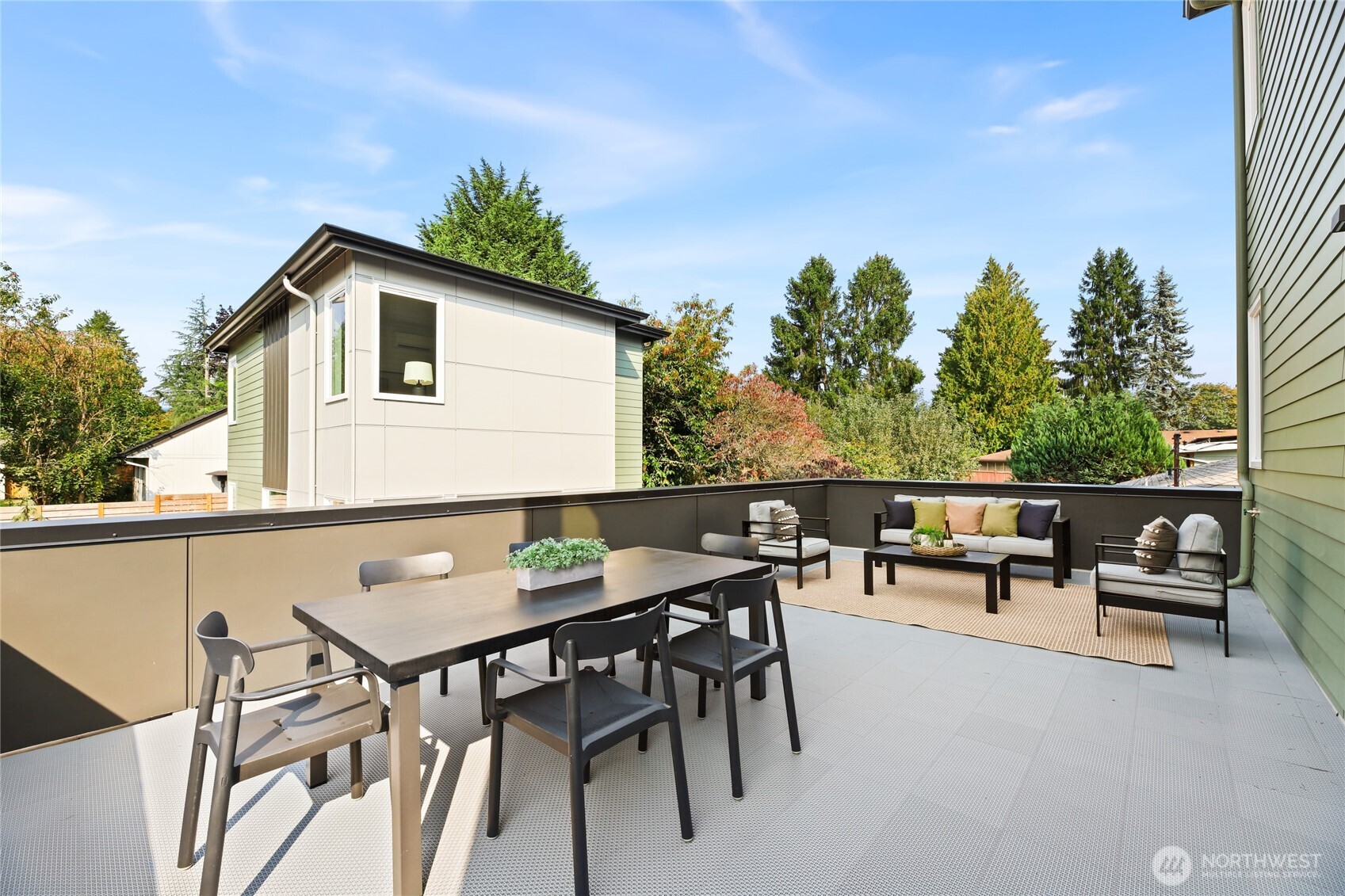 12037 Fremont Avenue North, Unit 1 Seattle, WA 98133 - Photo 16 of 30 a view of a patio with a table and chairs