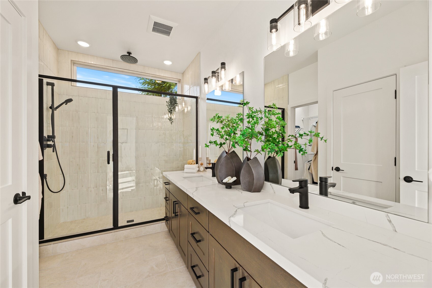 12037 Fremont Avenue North, Unit 1 Seattle, WA 98133 - Photo 21 of 30 a bathroom with a shower a sink and a mirror