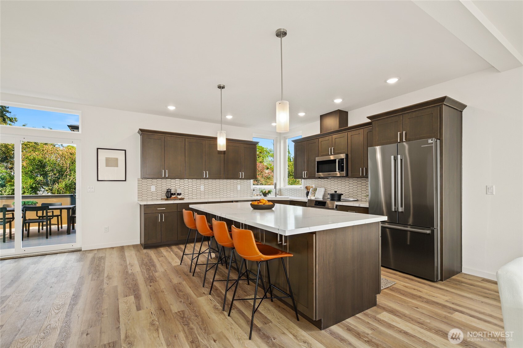 12037 Fremont Avenue North, Unit 1 Seattle, WA 98133 - Photo 10 of 30 a kitchen with stainless steel appliances granite countertop a sink a stove and a refrigerator