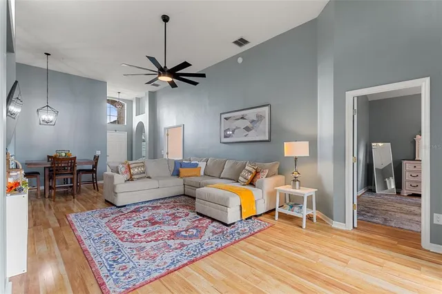 a bathroom with a granite countertop sink a toilet and a mirror