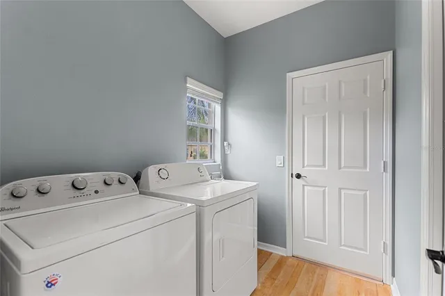 a aerial view of a house with a yard and potted plants