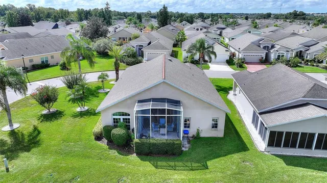 an aerial view of residential houses and outdoor space