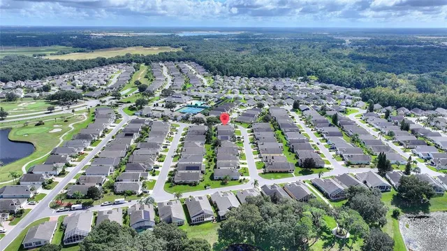 a building outdoor space with patio furniture and potted plants
