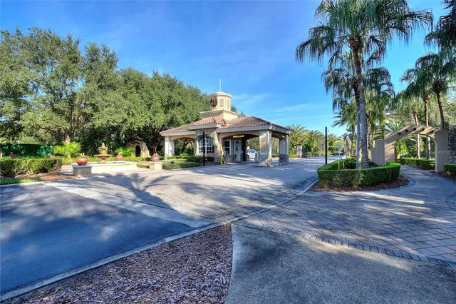 an aerial view of a house a yard swimming pool and outdoor seating
