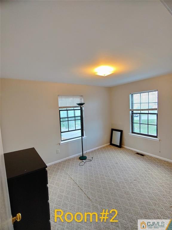 3305 Stonehedge Road Edison, NJ 08820 - Photo 11 of 14 an empty room with windows