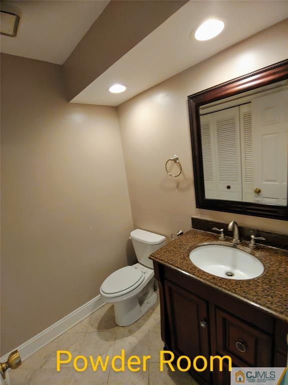 3305 Stonehedge Road Edison, NJ 08820 - Photo 12 of 14 a bathroom with a sink and a mirror