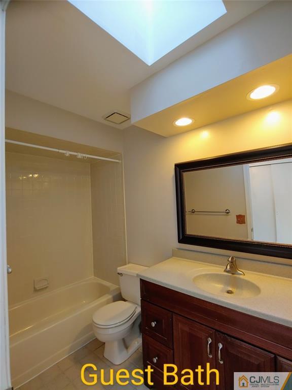 3305 Stonehedge Road Edison, NJ 08820 - Photo 13 of 14 a bathroom with a sink a toilet and shower