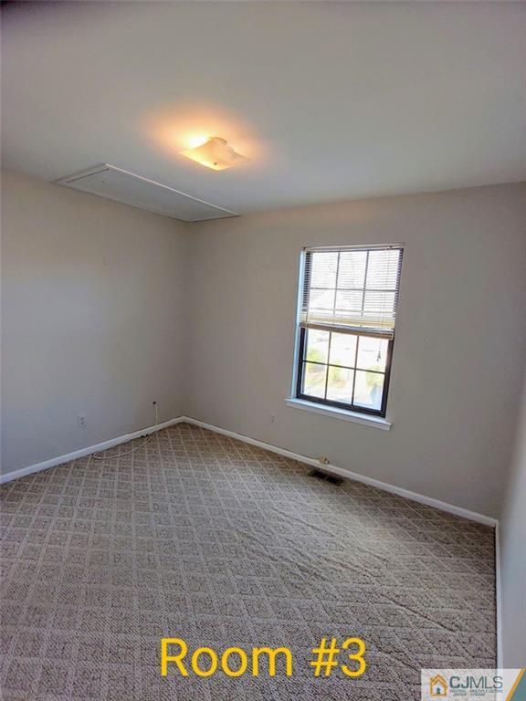 3305 Stonehedge Road Edison, NJ 08820 - Photo 10 of 14 an empty room with a space