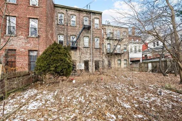 a view of hallway with wooden floor
