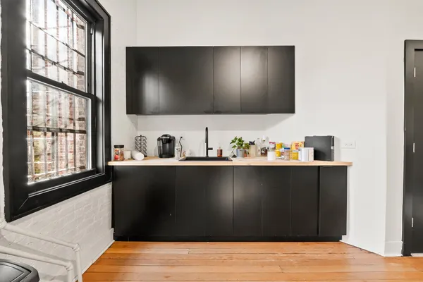 a living room with flat screen tv and a window