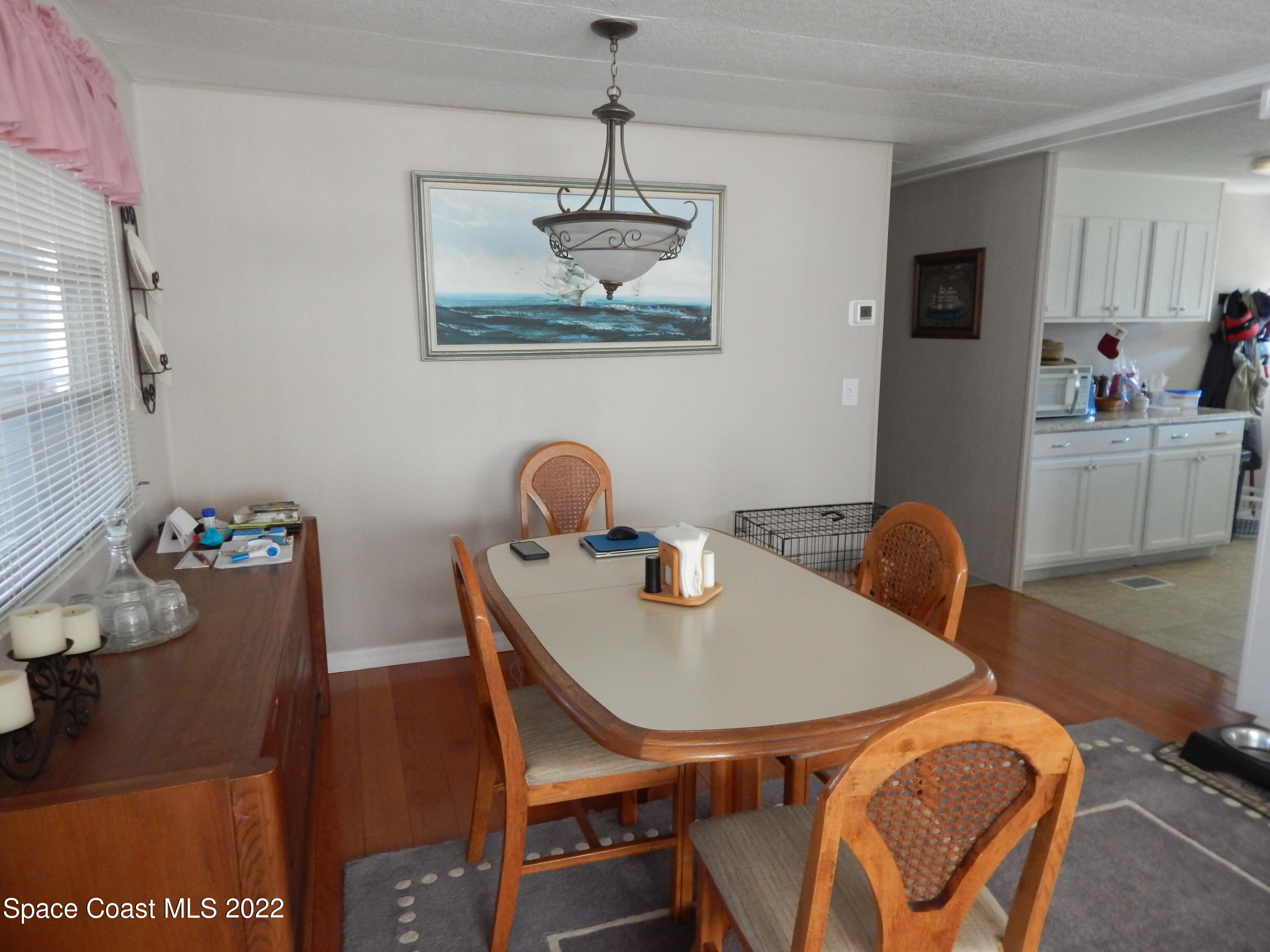 3112 Tangelo Drive Northeast Palm Bay, FL 32905 - Photo 11 of 42 a dining room with furniture and window
