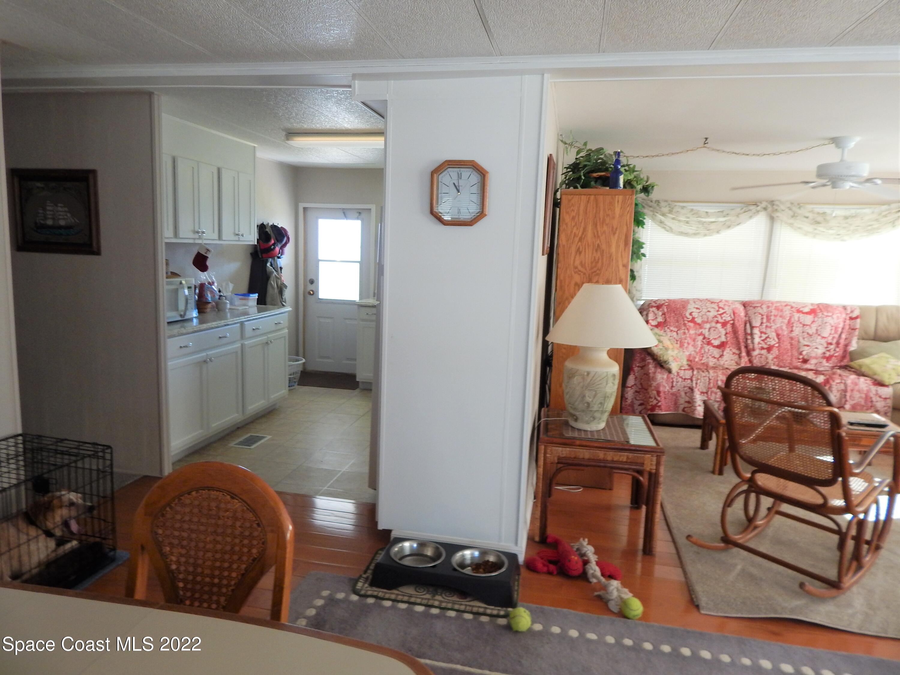 3112 Tangelo Drive Northeast Palm Bay, FL 32905 - Photo 13 of 42 a living room with furniture and a window