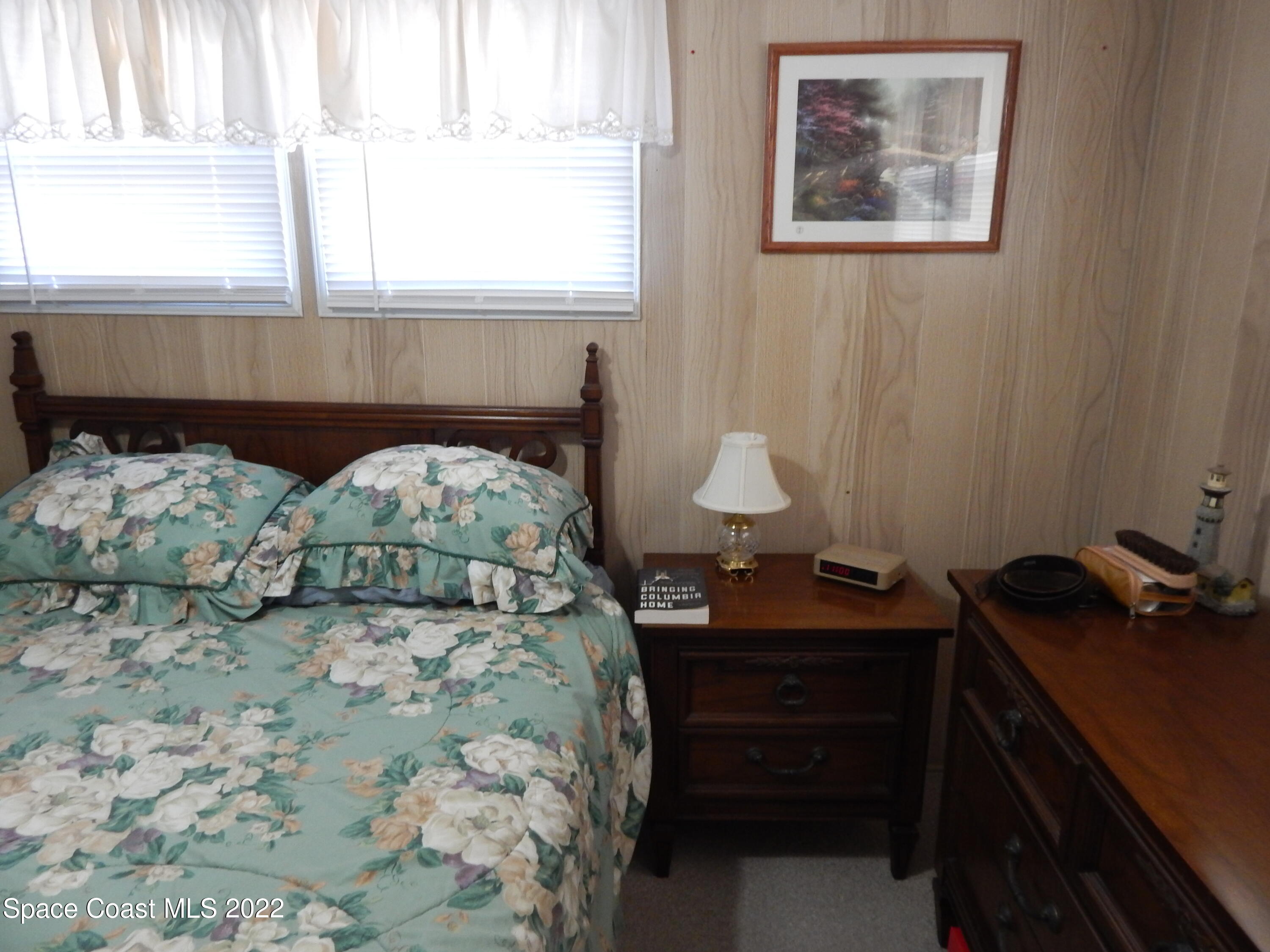 3112 Tangelo Drive Northeast Palm Bay, FL 32905 - Photo 16 of 42 a bedroom with a bed and a window