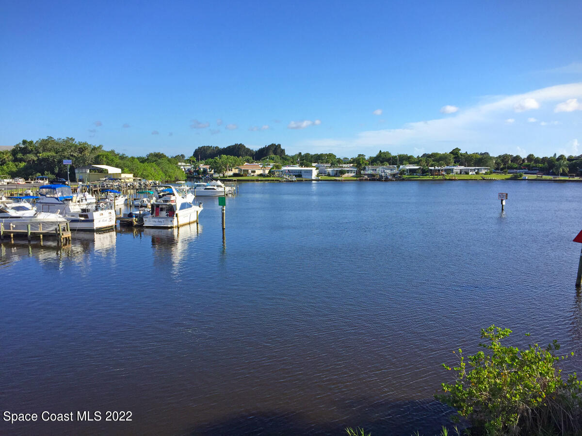 3112 Tangelo Drive Northeast Palm Bay, FL 32905 - Photo 31 of 42 a view of a lake with houses in the back