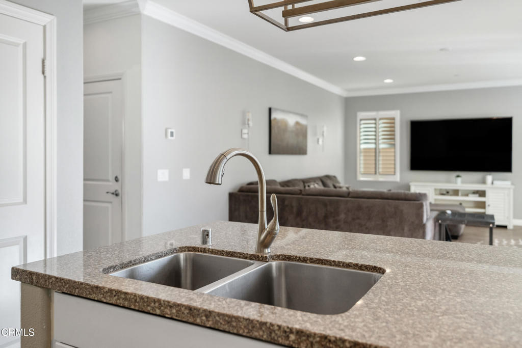 668 Whalen Way Oxnard, CA 93036 - Photo 11 of 57 a close view of a sink and a flat screen tv