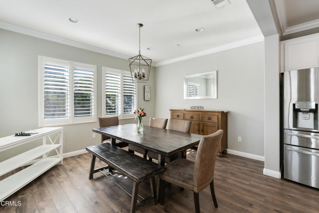 668 Whalen Way Oxnard, CA 93036 - Photo 17 of 57 a view of a dining room with furniture window and wooden floor