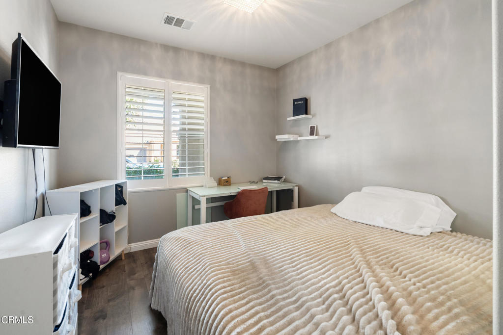 668 Whalen Way Oxnard, CA 93036 - Photo 19 of 57 a bedroom with a bed and a flat screen tv
