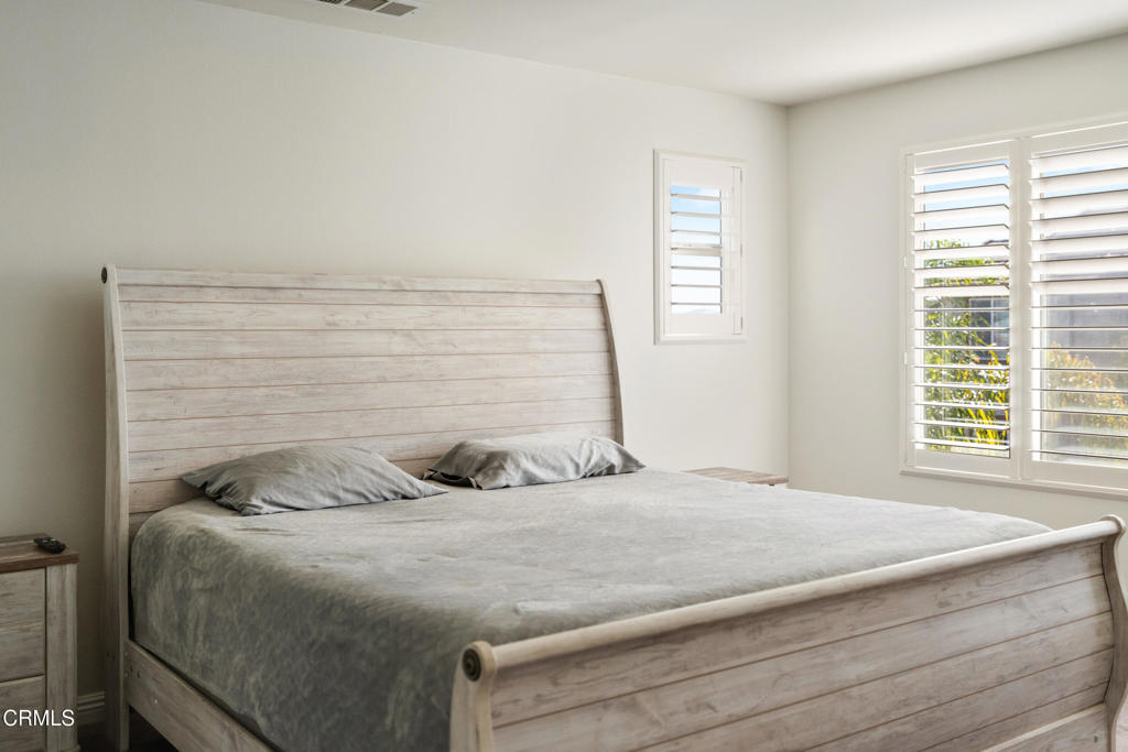 668 Whalen Way Oxnard, CA 93036 - Photo 26 of 57 a bedroom with a bed and a window