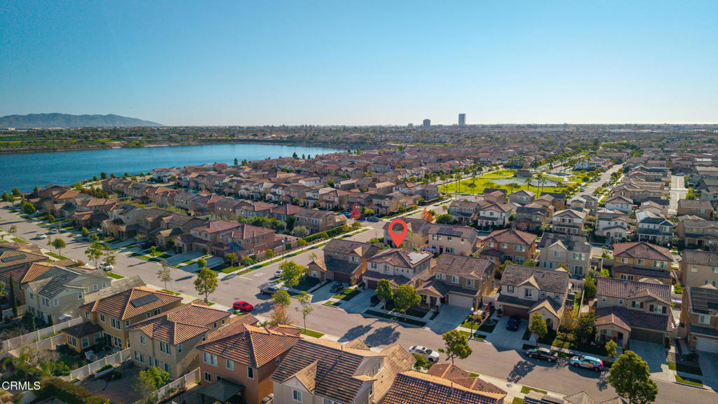 668 Whalen Way Oxnard, CA 93036 - Photo 41 of 57 an aerial view of a city with lots of residential buildings and mountain view in back