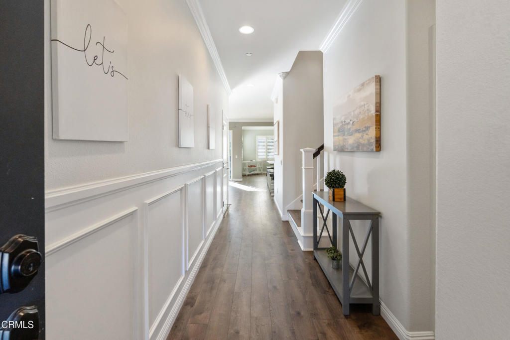 668 Whalen Way Oxnard, CA 93036 - Photo 6 of 57 a view of a hallway view with wooden floor and staircase