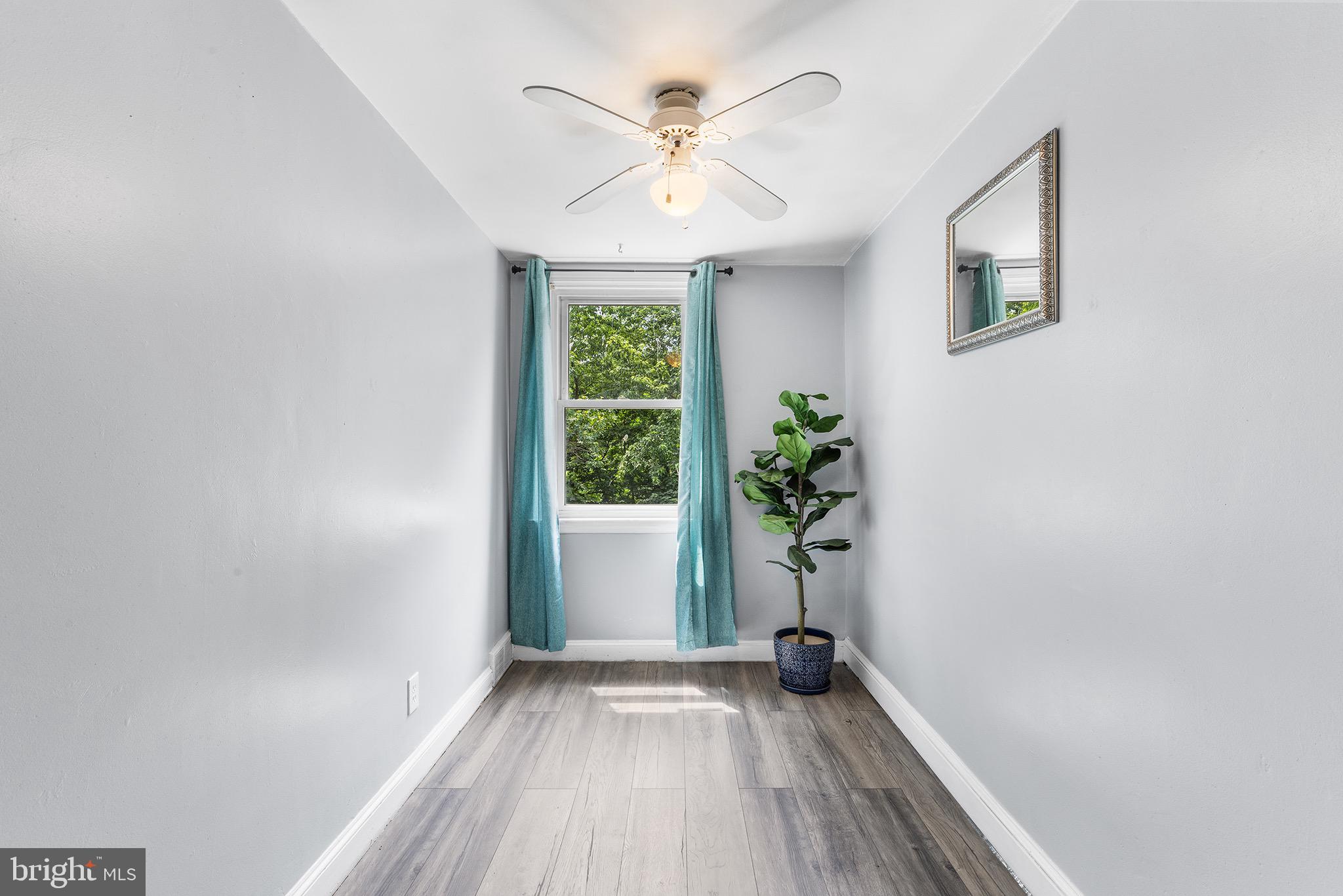 390 Glen Cove Road Collingdale, PA 19023 - Photo 17 of 27 a view of room with window and wooden floor