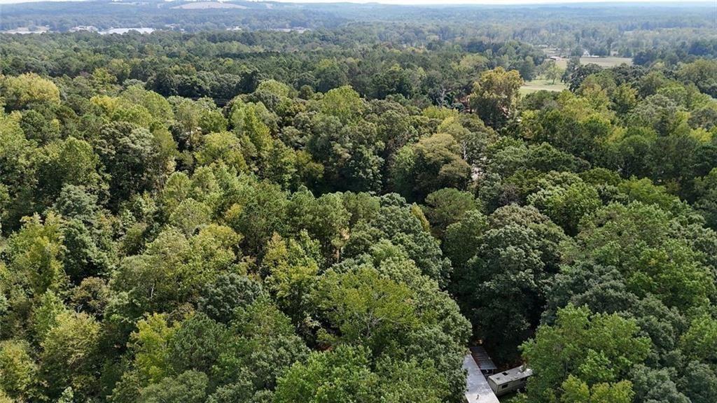 0 Bar J Road Temple, GA 30179 - Photo 1 of 7 an aerial view of residential house with outdoor space and trees all around