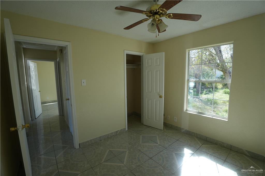 1006 East 23rd Street Weslaco, TX 78596 - Photo 6 of 9 a view of an empty room with a window