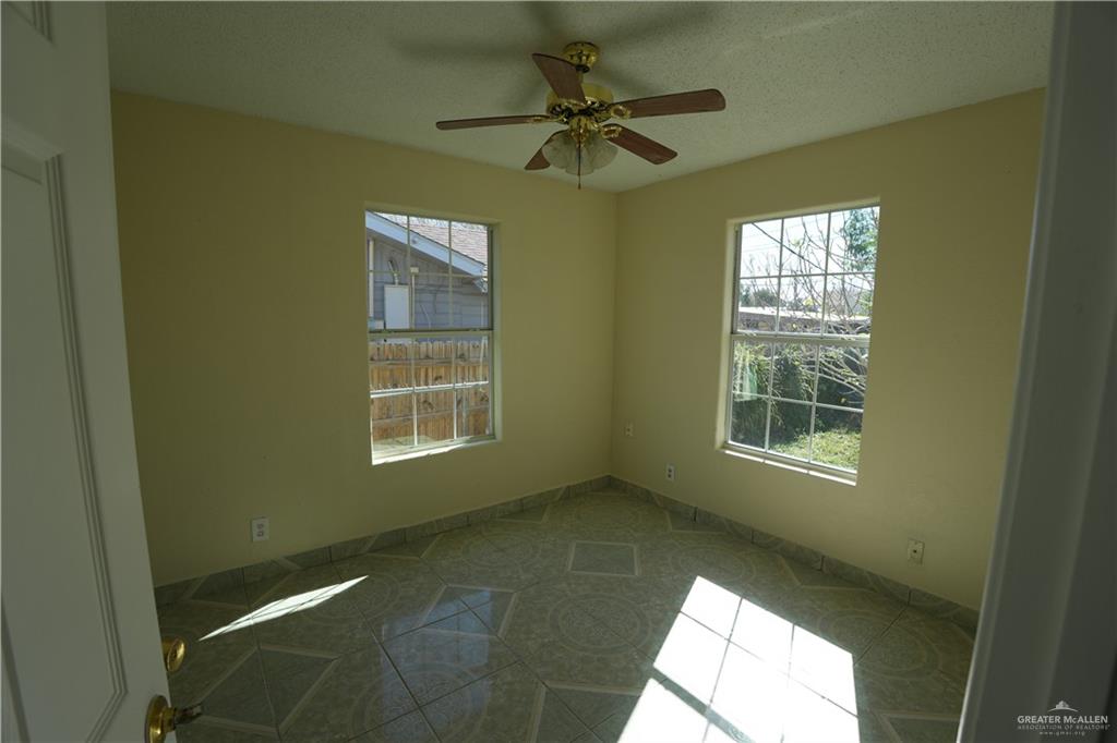 1006 East 23rd Street Weslaco, TX 78596 - Photo 7 of 9 a view of an empty room with a window