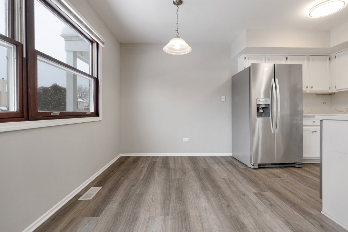 262 Inverrary Lane Deerfield, IL 60015 - Photo 13 of 26 a view of a room with wooden floor and windows