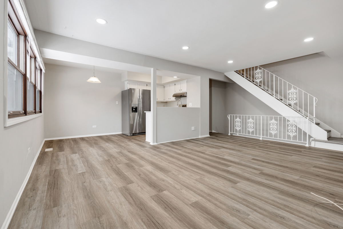 262 Inverrary Lane Deerfield, IL 60015 - Photo 15 of 26 a view of a hallway with wooden floor and staircase