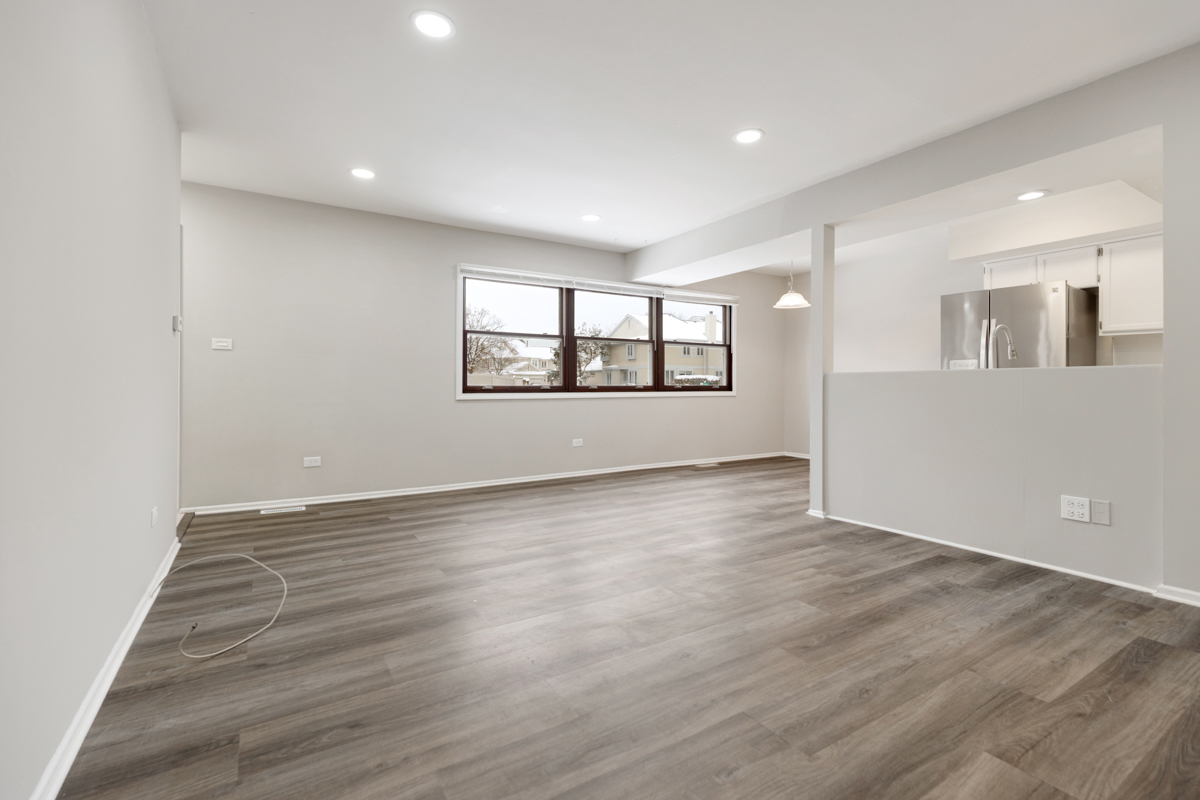 262 Inverrary Lane Deerfield, IL 60015 - Photo 6 of 26 an empty room with wooden floor and windows
