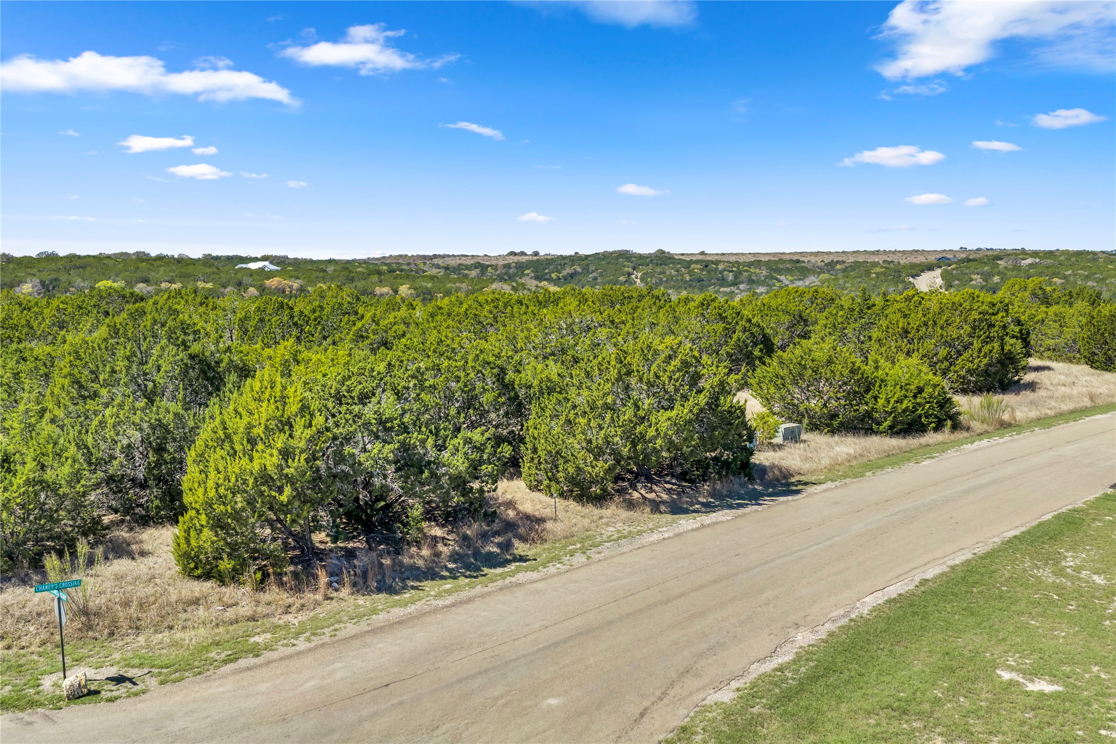 358 Balcones Ridgeway Way Bertram, TX 78605 - Photo 15 of 24 a view of a road with an ocean view