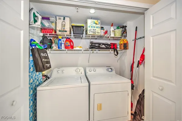a utility room with dryer and washer