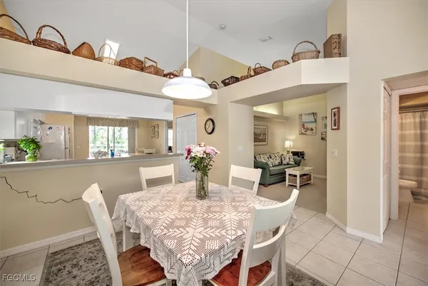 a dining room with furniture and window