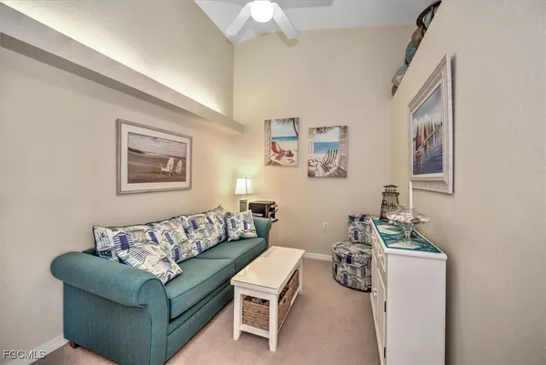 a living room with furniture and a table