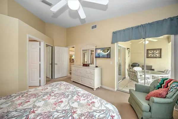 a bedroom with a bed and a couch