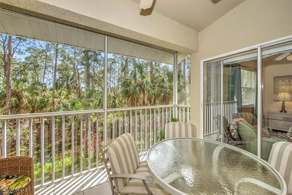 a view of a balcony and wooden floor