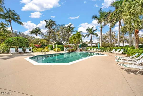 a view of a swimming pool and a yard