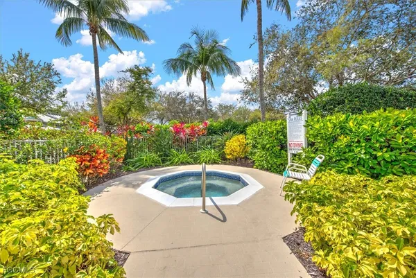 a view of a swimming pool with a yard