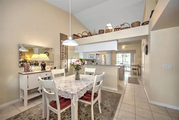 a dining room with furniture and window