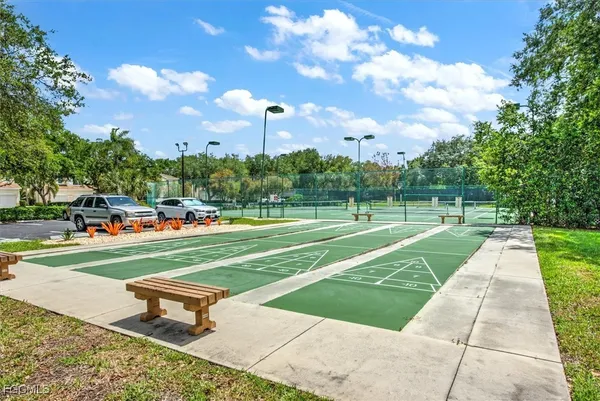 a park view with a sitting space and trees