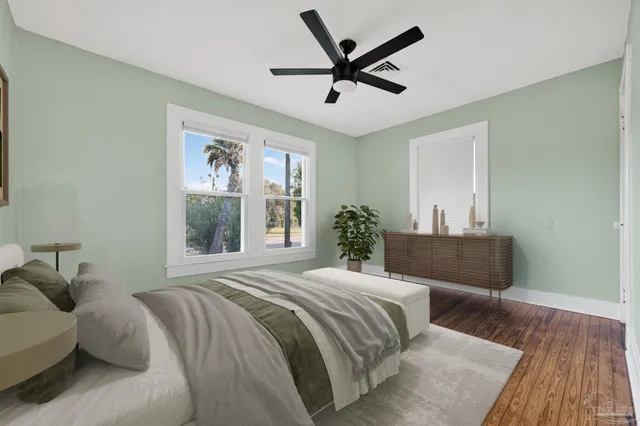 a bedroom with a large bed and a window