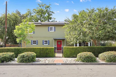 front view of a house with a yard