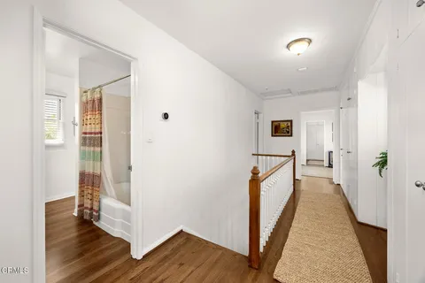 a spacious bedroom with two beds and a table