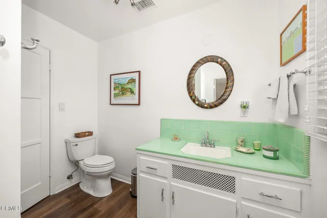 a view of a livingroom with workspace and a window