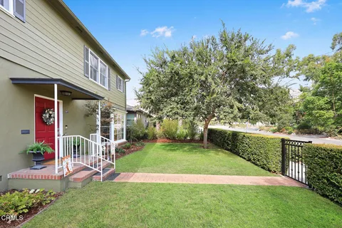 a view of living room with furniture and wooden floor