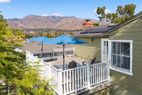 a view of backyard with swimming pool