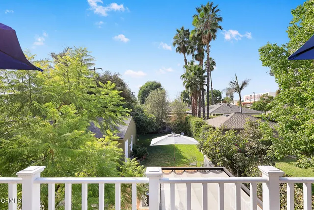 a view of a backyard with sitting area
